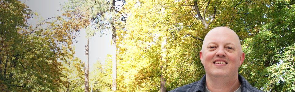 Jeff Thomas under fall trees in the Comstock neighborhood on Spokane's South Hill